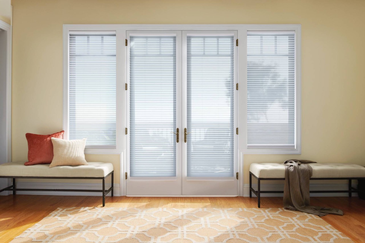 White Duette® Cellular Shades decorating a French door with sidelights near Honolulu, HI