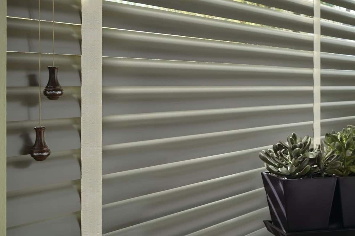 Hunter Douglas Modern Precious Metals® Aluminum Blinds closed with succulents in front