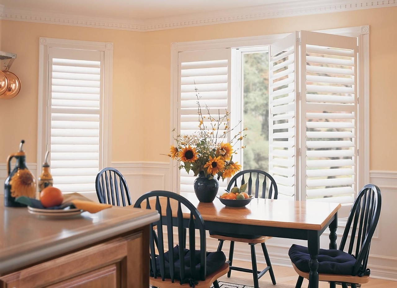 Home Kitchen with sliding Hunter Douglas Palm Beach™ PolySatin™ Vinyl shutters installed on a sliding glass door at Design 5 Ltd. near Honolulu, HI