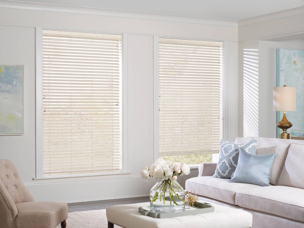 Hunter Douglas EverWood® Faux Wood Blinds in a living room with light blue and sand tones at Design 5 Ltd near Honolulu, HI